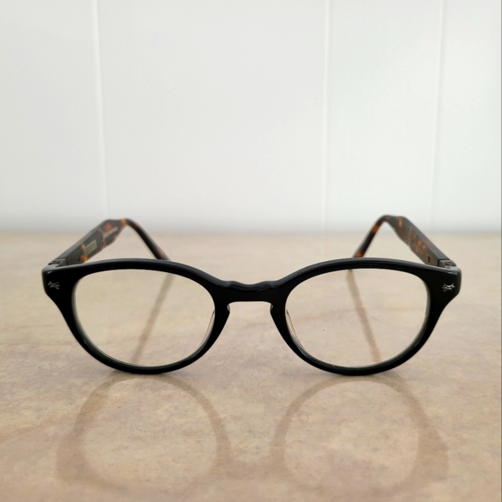 John Varvatos unisex eyeglass frames. Black front, brown tortoiseshell sides.